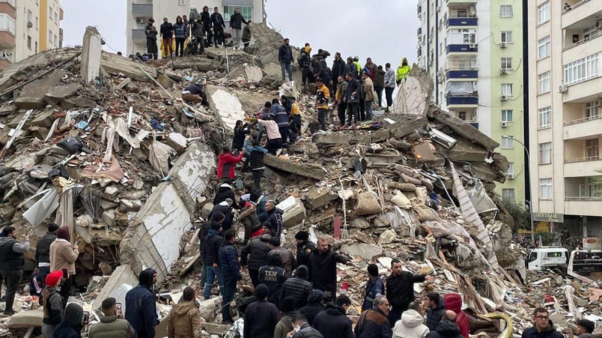 ADANA, TURKIYE - FEBRUARY 06: A person is rescued from the wreckage of a building during search and rescue efforts after a 7.4 magnitude earthquake hit southern provinces of Turkiye, in Adana, Turkiye on February 6, 2023. The 7.4 magnitude earthquake jolted Turkiye's southern province of Kahramanmaras early Monday, according to Turkiye's Disaster and Emergency Management Authority (AFAD). It was followed by a magnitude 6.4 quake that struck southeastern Gaziantep province. A third earthquake with a 6.5 magnitude also hit Gaziantep. Earthquakes had affected several provinces including, Osmaniye, Malatya, Adiyaman, Adana, Diyarbakir, Kilis and Sanliurfa. (Photo by Eren Bozkurt/Anadolu Agency via Getty Images)